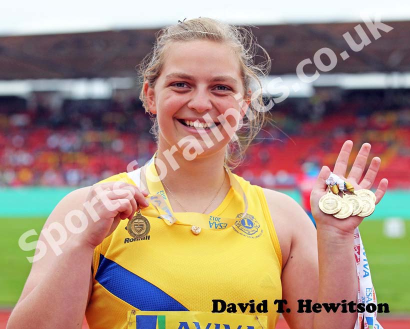 Senior hammer winner Abbi Carter with her six medals.